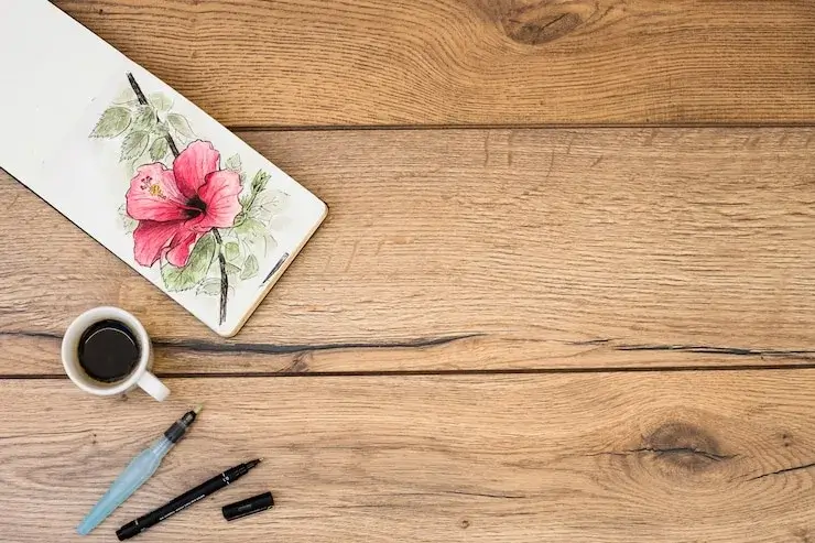 Close-up of print samples on a wooden desk